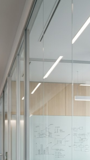 A boardroom chair with a city view outside the window